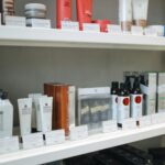 A variety of skincare and beauty products displayed neatly on store shelves.